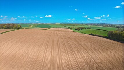 Fototapeta premium Sunny Freshly Ploughed Farmers Field in Dorset