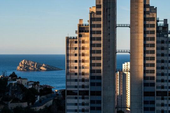 Island and sea meet the waterfront where towers and skyscrapers define Benidorm architecture in Alicante Valencian Spain