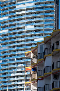 Repeating balconies create a modern facade pattern across a highrise tower showcasing architecture from Benidorm Alicante Spain