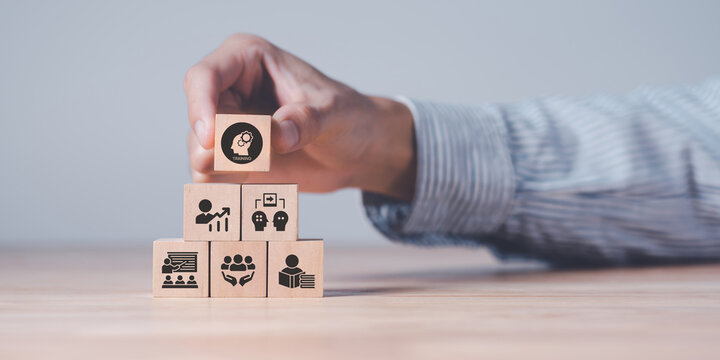 Human resource training and development concept.Business, personal development improving and enhancing competency, performance..Putting wooden cubes training with brainstorm, coaching, learning icons.