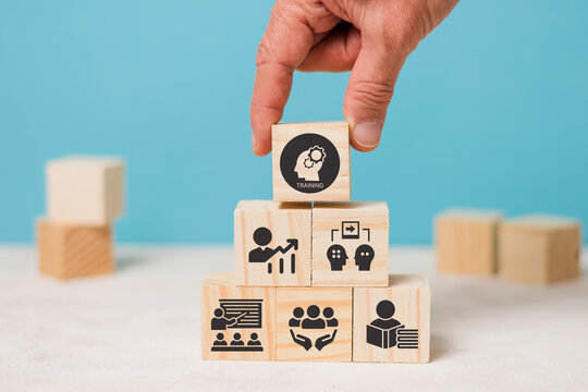 Human resource training and development concept.Business, personal development improving and enhancing competency, performance..Putting wooden cubes training with brainstorm, coaching, learning icons.