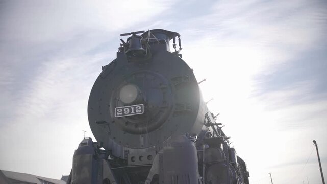 Silhouette of Santa Fe 2912 Steam Locomotive with Sun Flare in Pueblo Colorado USA