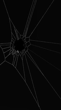 Glass cracks and lines for VFX and Video Editing, Glass Shatter Screen monitor broken background displays intricate, shattered glass with a central hole and radiating cracks. Broken window concept