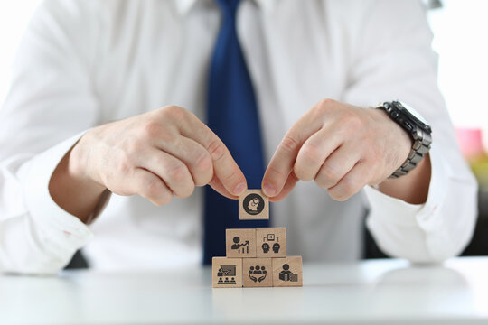 Human resource training and development concept.Business, personal development improving and enhancing competency, performance..Putting wooden cubes training with brainstorm, coaching, learning icons.