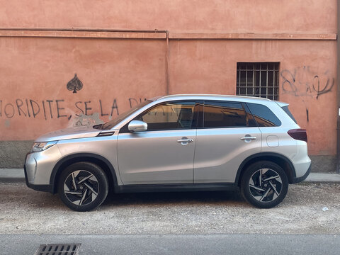Suzuki Vitara compact crossover SUV parked on an urban street showing automotive design and modern vehicles