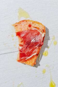 a bitten pa amb tomaquet with cured ham