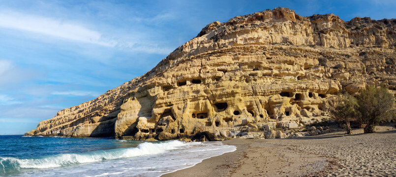 Greece Crete 14K Photo of Matala Beach Caves at Sunrise with Yellow Stone Cliffs and Crashing Waves Scenic Empty Beach and Ancient Neolithic Heritage Travel, cretan best beaches