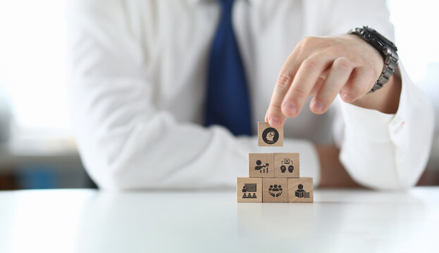 Human resource training and development concept.Business, personal development improving and enhancing competency, performance..Putting wooden cubes training with brainstorm, coaching, learning icons.