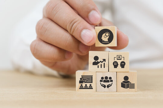 Human resource training and development concept.Business, personal development improving and enhancing competency, performance..Putting wooden cubes training with brainstorm, coaching, learning icons.
