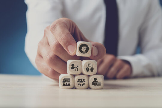 Human resource training and development concept.Business, personal development improving and enhancing competency, performance..Putting wooden cubes training with brainstorm, coaching, learning icons.