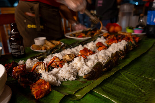 Traditional Filipino Boodle Fight feast on banana leaves