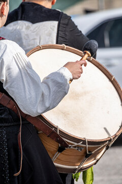 Traditional drummer playing a large bass drum The Concept of folk music