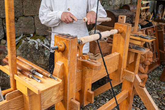 Artisan hands holding a wooden board at a craft market The Concept of Skill