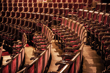 Fototapeta premium Empty rows of theatre seats in a classical hall