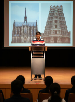 Indian boy giving a presentation on architecture at school. Student speaking at podium in front of audience. Comparison of gothic cathedral and hindu temple. Education and learning concept.