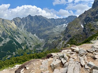 Fototapeta premium Rocky mountain valley with cloudy sky