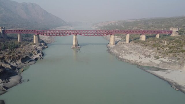 Historic Attock railway bridge panoramic aerial shot over calm Indus River pakistan