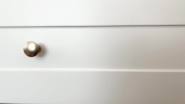White Wooden Drawer Front with Round Metal Knob Minimal Furniture Detail Clean Interior Design, Close Up Video