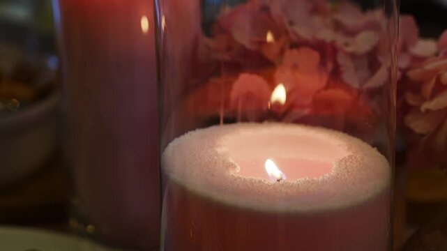 Candlelight and flowers create a warm setting for dinner