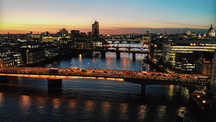 Fototapeta premium London city skyline with bridges over river thames at sunset