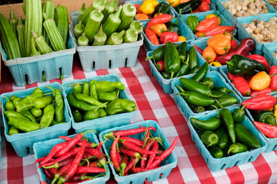 Colorful peppers in cartons at farmers market