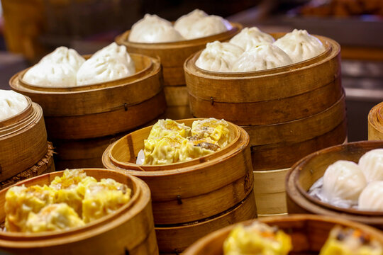 Assorted steamed dim sum in bamboo baskets