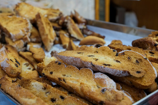 Sicilian sweet bread slices with raisins on bakery tray