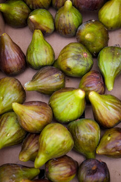 Fresh green and purple figs close up
