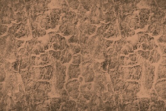 Brown cracked earth texture background, top view of dry soil or stone pattern