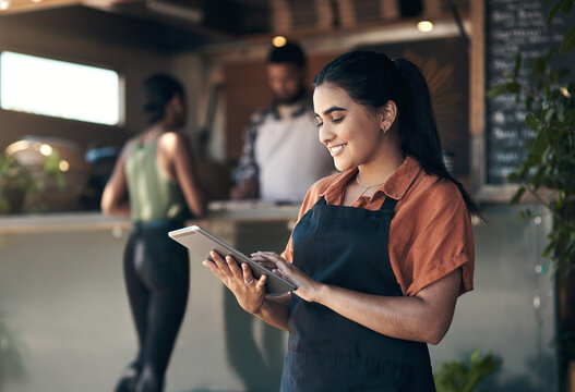 Waitress, tablet and scroll with woman in restaurant for small business, menu planning and startup. Entrepreneur, cafe shift roster and hospitality with person at coffee shop for catering app