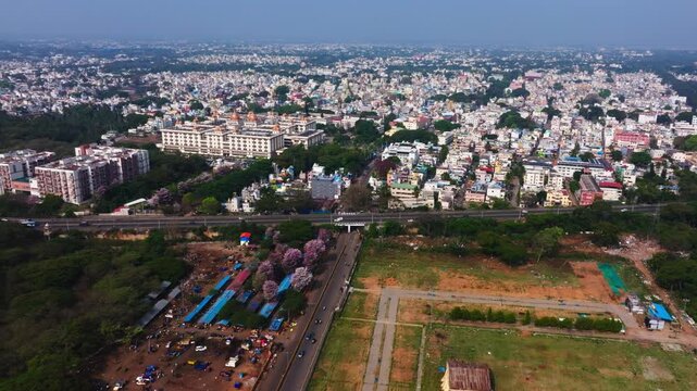 Aerial of City of Palaces with JSS Hospital, Brigade Mountain View apartments and Mg road at Mysuru, karnataka, india. day time, push in shot, drone shot, 4k.