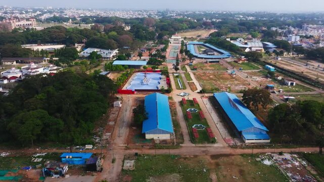 Dasara Exhibition Ground with Devaraja Arasu Multipurpose Stadium and Food Craft Institute at Mysuru, karnataka, india. day time, push back shot, drone shot, 4k.