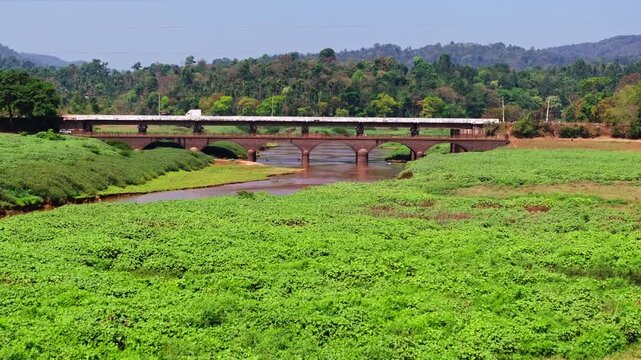 harangi river with Hardoor Bridge, greenery and mountains at SH 8, Anjanageri Bettageri, Karnataka, india. day time, push in shot, drone shot, 4k.