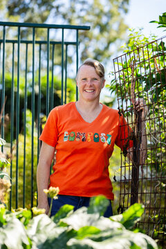 portrait of an eco friendly advocate in backyard vegetable garden