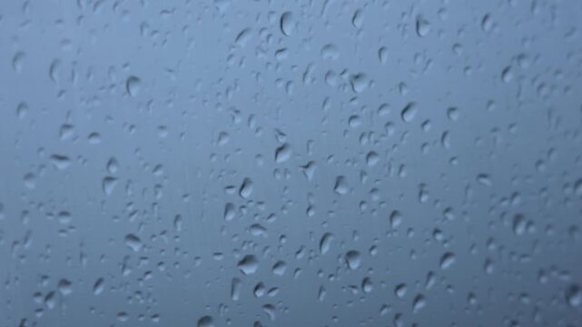 4K glass window raining raindrops artistic conception empty mirror real shot video