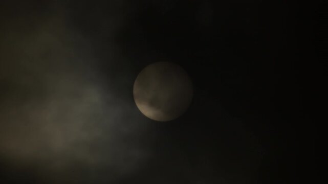 Sun and black dust clouds of calima or kalima in a cloudy day