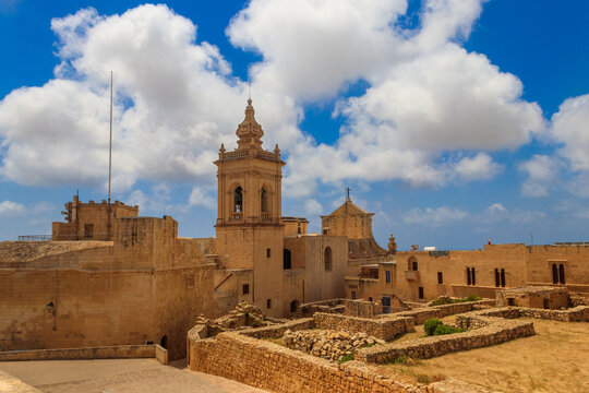 View of Cathedral of the Assumption, historic stone walls and  ancient architecture in the Cittadella, also known as the Castello, citadel of Victoria on the island of Gozo, Malta