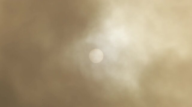 Sun with clouds of calima or kalima