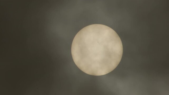 Sun and black dust clouds of calima or kalima