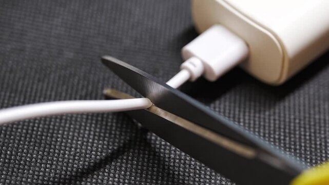 Cutting a damaged charging cable for repair