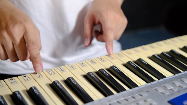 Learning to play basic piano keyboard for beginner practicing music instrumental self studying at home. educational content.