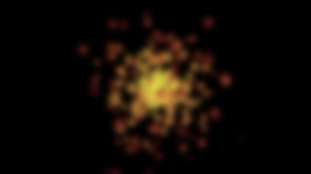 Golden particles swirl against a black background. They radiate from a bright center, glowing warmly. The motion feels alive and energetic