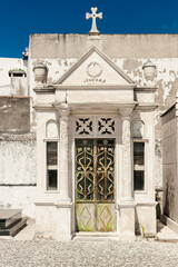 Obraz premium Old white abandoned crypt at the cemetery in Nazare, Portugal.