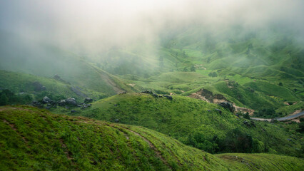Markham Valley in Meghalaya, Rolling Green Hills and Deep Mountain Valley Shrouded in Monsoon Fog, Eastern West Khasi Hills, India © suparna