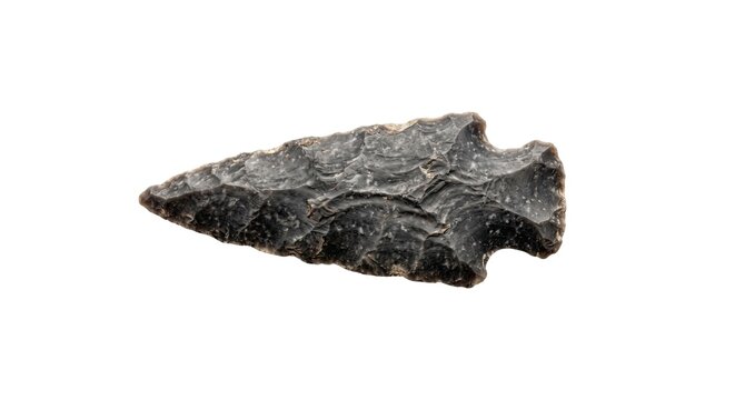 Ancient black flint arrowhead or stone tool isolated on transparent background representing archaeological discovery