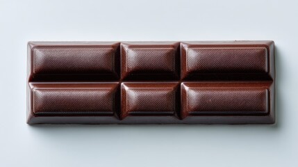Naklejka premium Smooth Dark Chocolate Bar With Geometric Design On A Light Background Ideal For Dessert, Snack, Confectionery, And Culinary Photography Projects