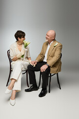 Fototapeta premium Senior couple sharing a loving moment while holding hands and enjoying each others company