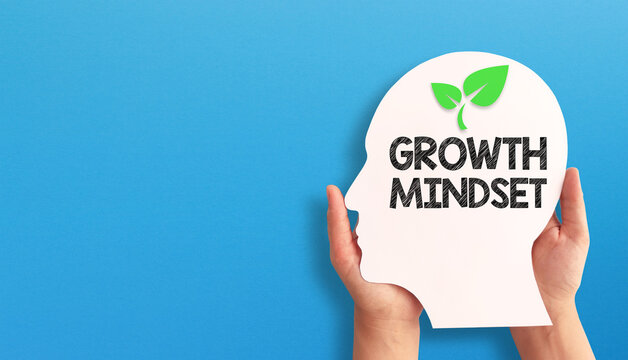 Growth Mindset Concept with Human Head Silhouette on Blue Background