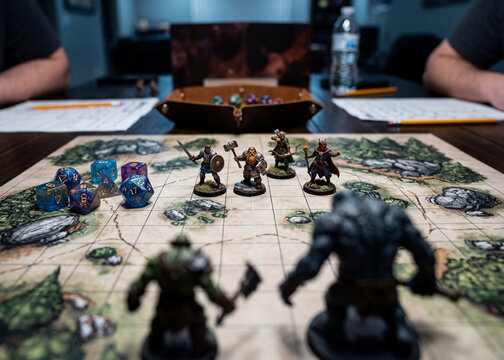 Fantasy tabletop role playing game miniatures on battle map