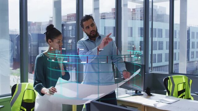 Man gesturing to AR ring while woman holding plan, AR nodes highlighting design section for review